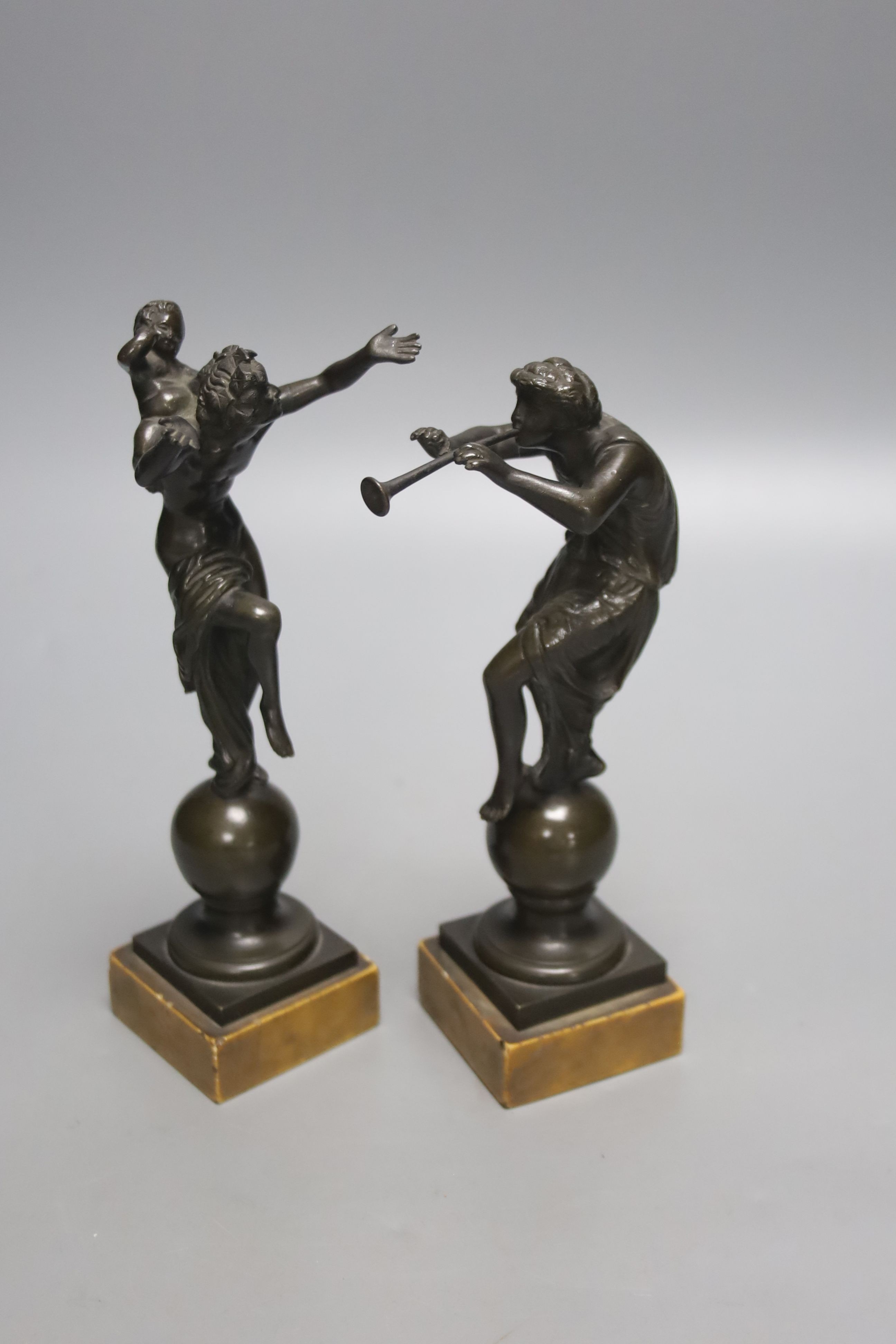 After the Antique. A pair of Grand Tour bronze classical figures, unsigned, on marble plinths, height 19cm